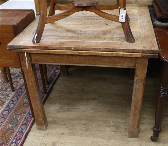 An oak draw leaf dining table W.99cm